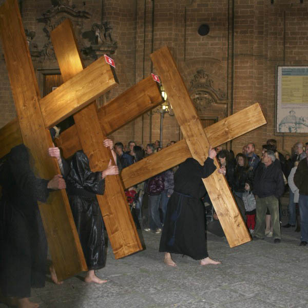 Image of penitents carrying the Cross during Easter in Francavilla Fontana