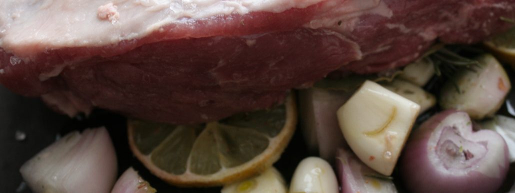 Slow roasted lamb with herbs and onions - Italian Notes