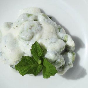 Fresh ricotta with fava beans and herbs