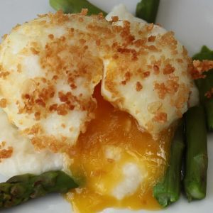 Asparagus with soft boiled egg in bread crumbs