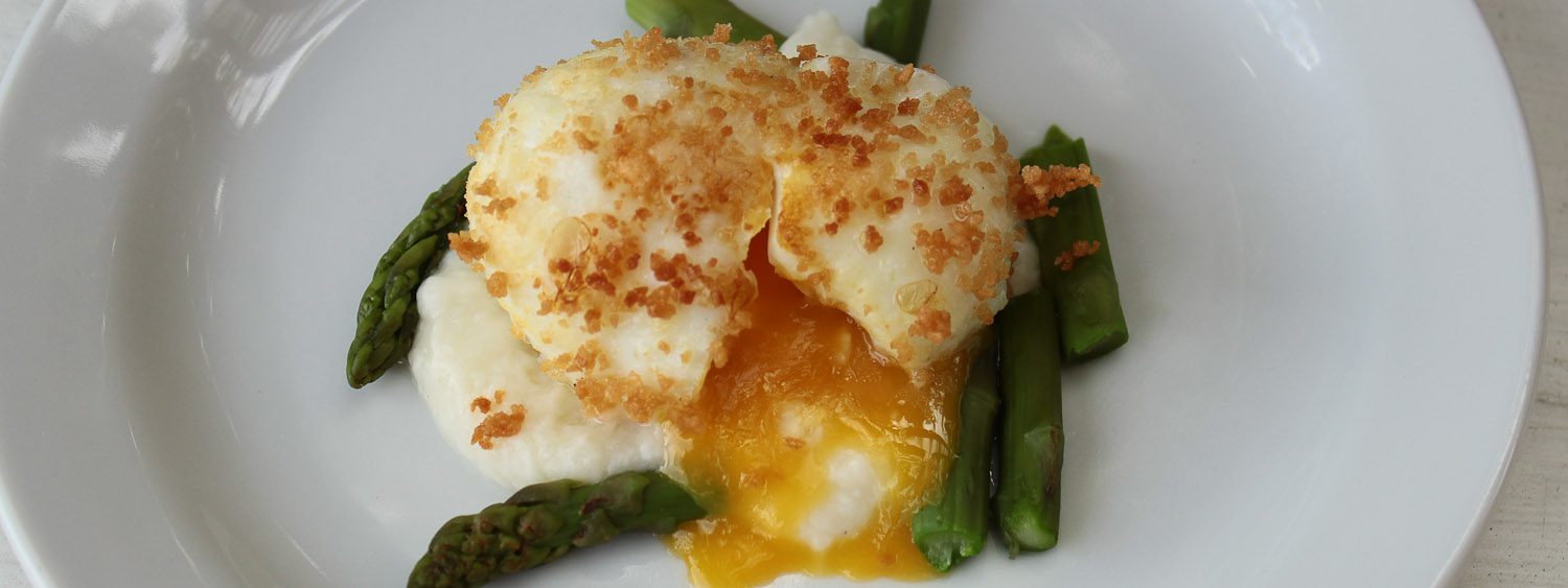 Asparagus with soft boiled egg in bread crumbs